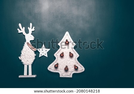 Christmas wooden decoration on vintage blue background with copy space - Christmas card
