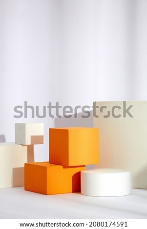 Front view of white and orange podium with in a white background for advertising , abstract content