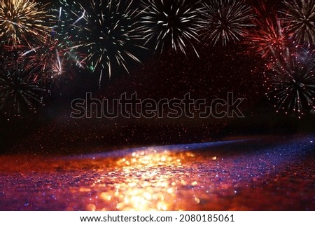 abstract black and gold glitter background with fireworks. christmas eve, 4th of july holiday concept