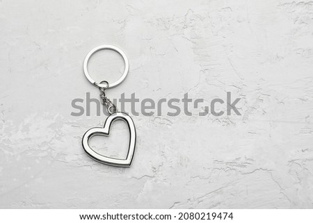 Heart shape keychain on light background