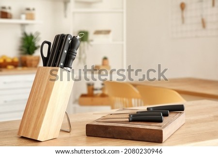 Set of knives on table in kitchen Royalty-Free Stock Photo #2080230946