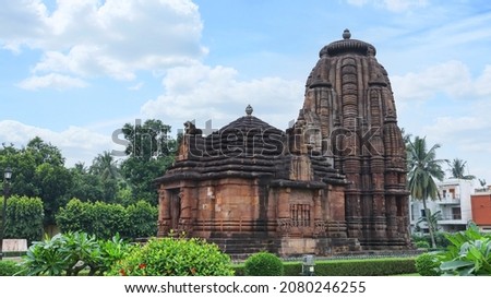 Façade of Jagamohana and Vimana of Rajarani Temple. 11th century Odisha style temple constructed dull red and yellow sandstone, Bhubaneswar, Odisha, India. Royalty-Free Stock Photo #2080246255