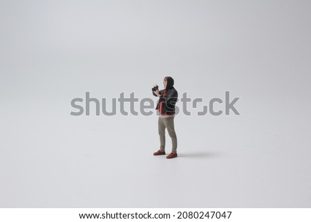 the mini figure of man taking pictures next