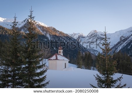 Small church with snowy mountain peak behind, Lesachtal, Carinthia, Austria