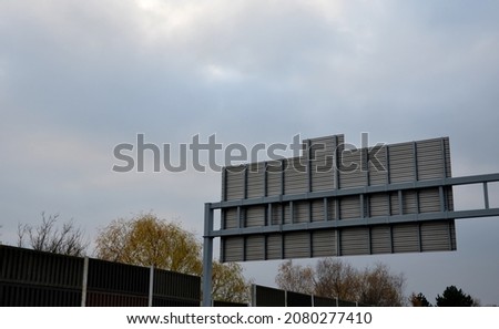 rear side of retractable highway signs. traffic signs of larger dimensions are composed of individual row aluminum sheets joined together on a thicker gate-shaped structure