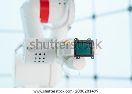 Robot arm with CCD and CMOS matrix Image sensor in the manipulator. Concept on the topic of artificial vision and pattern recognition Royalty-Free Stock Photo #2080281499