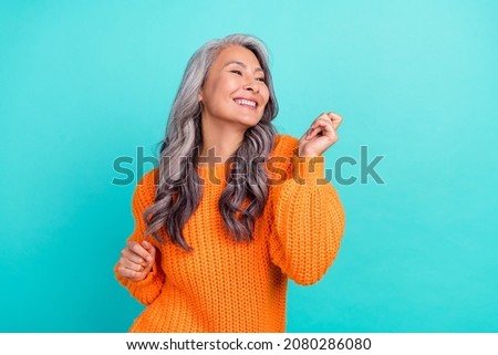 Profile side photo of mature cheerful pretty lady have fun clubber look empty space isolated over turquoise color background Royalty-Free Stock Photo #2080286080