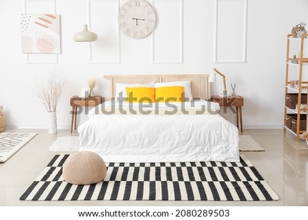 Interior of modern bedroom with carpets