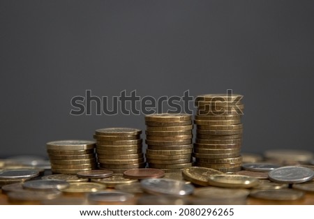 the steps from the stacks of coins. dark background, copy space. defocus