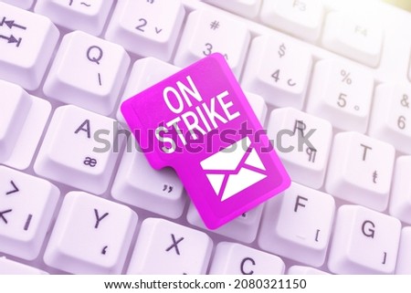 Text caption presenting On Strike. Business overview refuse to continue working because of an argument with an employer Publishing Typewritten Fantasy Short Story, Typing Online Memorandum