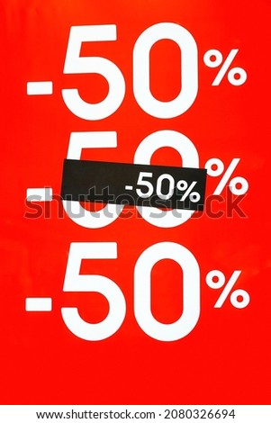 Red poster -50% in store on Black Friday. Sale shopping season, promotion discount in shop