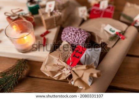 winter holidays and hobby concept - close up of christmas gifts for advent calendar at home