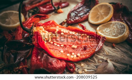 Owen-baked red paprika peppers with garlic and olive oil. Toned picture