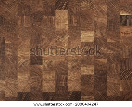 Brown oak wooden butcher chopping block, natural durable end grain hard wood cutting board texture background pattern, close up Royalty-Free Stock Photo #2080404247