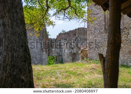 the ruins of the fortress wall overgrown with grass. High quality photo