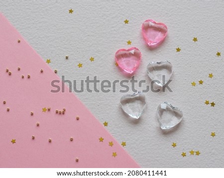 Hearts background. Valentine's Day decoration. Top view flatlay. Photo for children's party. Design of Greeting Card With wooden handmade figurines of hearts.red trending colors