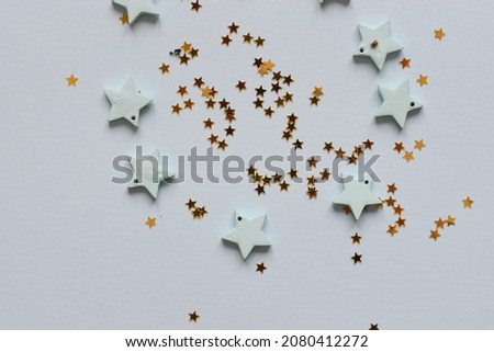 NEW YEAR and Christmas Stars background. Different colours. Christmas decoration. Symbol of holiday. Stars.Top view flatlay . background for children's party. Design of Greeting Card 