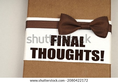 Finance and business concept. On the packing box with a bow-tie the inscription - Final Thoughts
