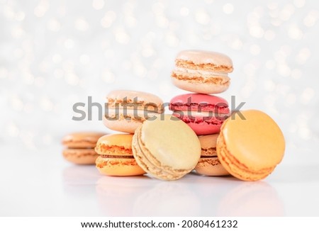 Colorful Macarons on White Illuminated Holiday Background