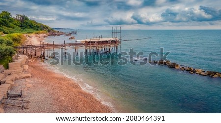 Gloomy summer view from flying drone of popular tourist attraction - Trabocco Turchino. Amazing morning seascape of Adriatic sea, Italy, Europe. Traveling concept background.