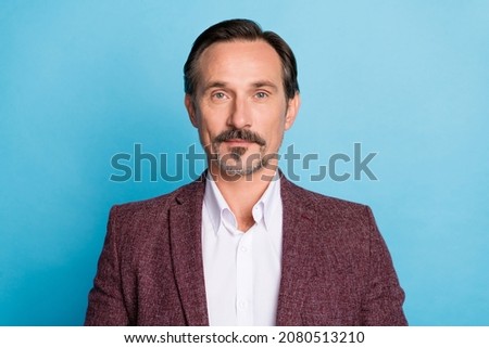 Photo of confident successful masculine handsome man look camera wear red blazer isolated blue color background