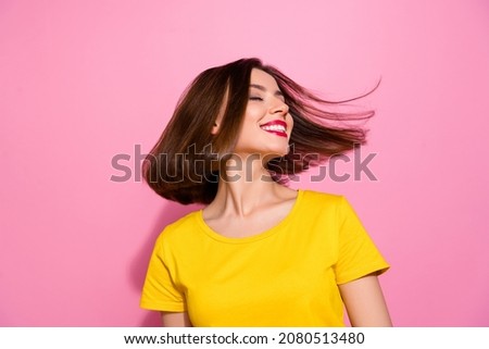 Portrait of attractive dreamy cheerful girl throwing hair having fun isolated over pink pastel color background Royalty-Free Stock Photo #2080513480
