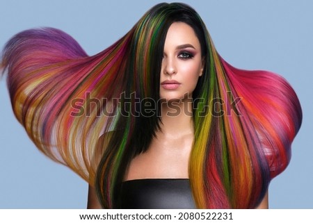 Beautiful woman with multi-colored hair and creative make up and hairstyle. Beauty face. Royalty-Free Stock Photo #2080522231
