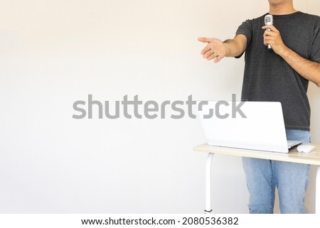 Image of a man giving a presentation (Japanese, 30s, shirt)