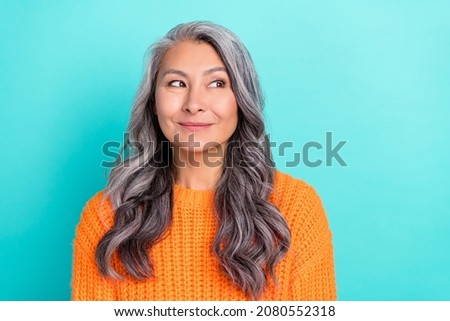 Portrait of attractive cheerful curious grey-haired woman thinking guessing isolated over bright teal turquoise color background Royalty-Free Stock Photo #2080552318