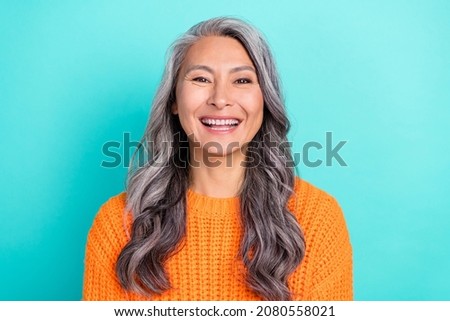 Portrait of attractive cheerful glad grey-haired woman laughing funny joke isolated over bright teal turquoise color background Royalty-Free Stock Photo #2080558021