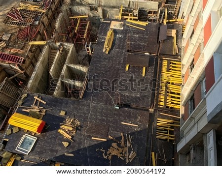Monolithic construction of high-rise buildings. Preparation for pouring concrete floors. Steel formwork and scaffolding. Photo from above