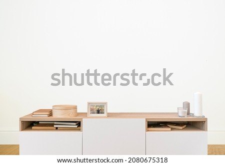 Living room interior with empty white wall for painting, photography or TV. White wall background, living room mockup.