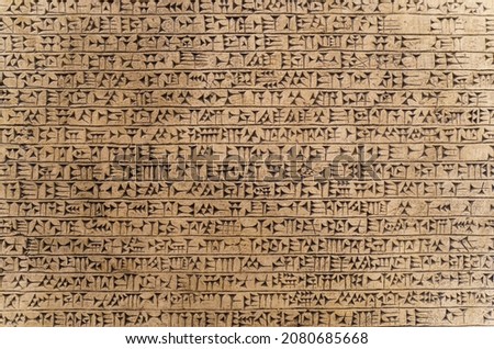 Babylonian historical writing background. Ancient hieroglyphs of the Sumerian and Babylonian civilizations. Archaeological objects and antiquities Royalty-Free Stock Photo #2080685668