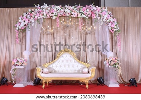 stage decoration with flowers an Indian traditional wedding setup Royalty-Free Stock Photo #2080698439