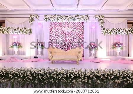 Indian wedding stage decorations with red white and green flowers Royalty-Free Stock Photo #2080712851
