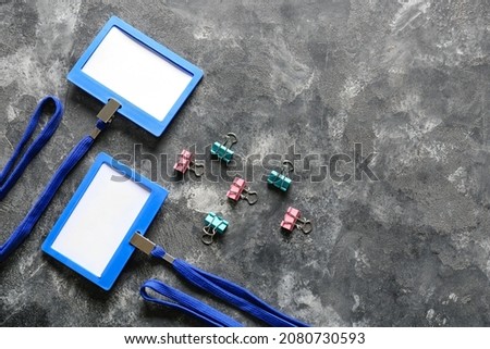 Blank badges and stationery on table