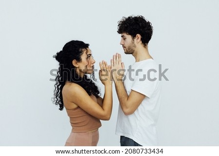 woman and man engaged in paired gymnastics yoga asana