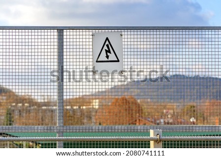 Electrical Hazard Danger Bolt Sign at Railroad Fence