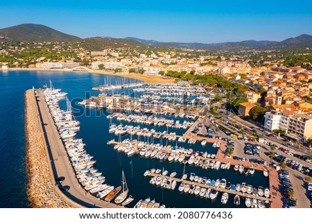 Summer aerial view of French coastal town of Sainte-Maxime on Mediterranean coast overlooking marina  Royalty-Free Stock Photo #2080776436