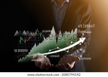 Hand hold sales data and economic growth graph chart. Business planning and strategy. Analysing trading of exchange. Financial and banking. Technology digital marketing.Profit and growing plan