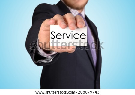 picture of man hand with card with service word