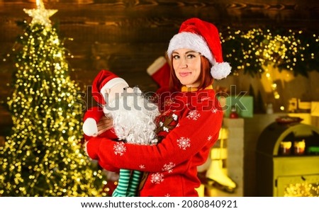 Great gift. christmas time composition. happy new 2021 year. cheerful girl wait for xmas presents. time to buy gifts. shopping sales. holiday preparation and celebration. woman wear santa claus hat