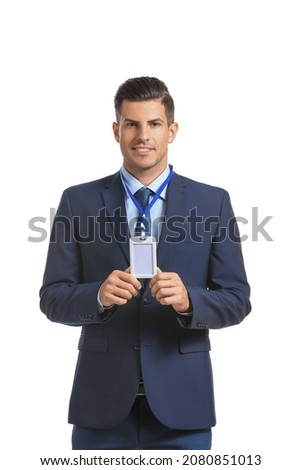 Elegant man in suit with blank badge on white background