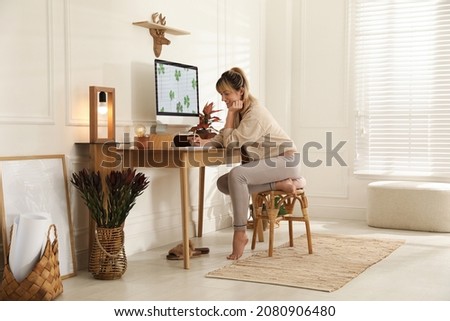 Woman at workplace in room. Interior design