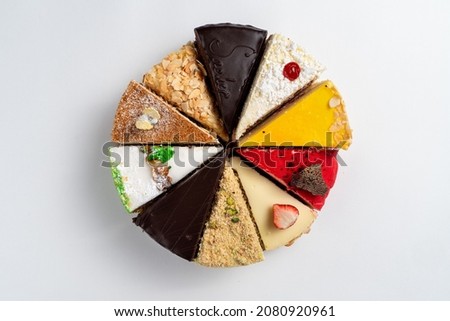 Top view of different slices of various cakes, making a single whole torte, top view on white background