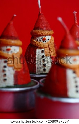 Santa Claus Christmas candle. Snowman