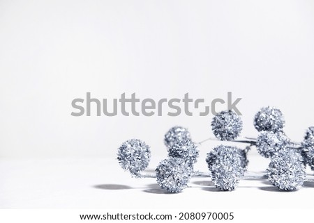 Creative layout of Christmas geometric decorations with balls Christmas tree on a white background in the rays of the sun with shadows. Minimal winter festive christmas new year exotic concept with 