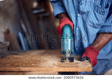 Man assembling furniture and fixing it - hobby concept. Royalty-Free Stock Photo #2080973626