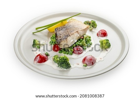 Pike perch on a vegetable pillow . Isolated on a white background.