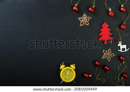 Christmas decoration. Red tree, red balls and snowflakes Greeting card.